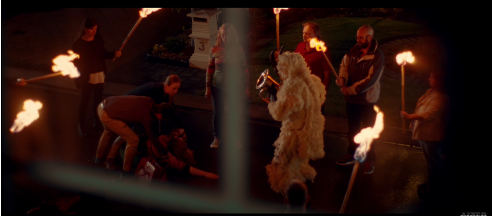 Townspeople perform a ritual in 'Carrie's Doing Great'