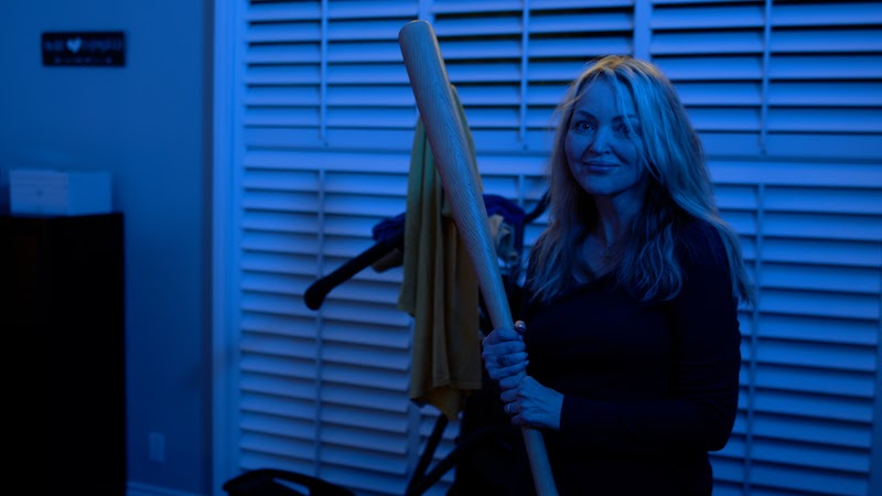 Tuesday Knight wielding a bat in the film Sitting Duck